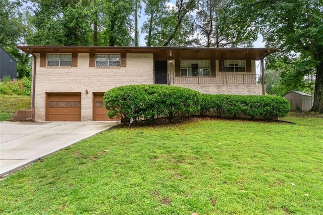 900 Fleetwood Cir, Atlanta, GA 30311 - view of front of property featuring a garage, concrete driveway, a front lawn, and brick siding