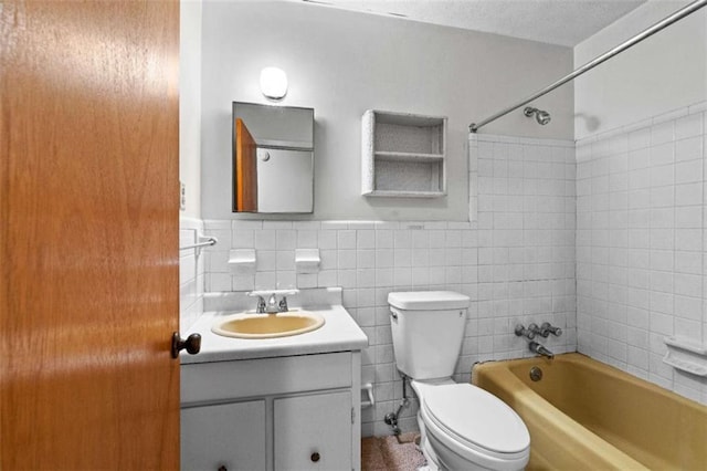 900 Fleetwood Cir, Atlanta, GA 30311 - full bath featuring toilet, vanity,  shower combination, tile walls, and a wainscoted wall