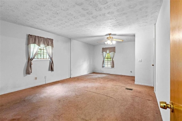 900 Fleetwood Cir, Atlanta, GA 30311 - carpeted empty room with healthy amount of natural light, ceiling fan, a textured ceiling, and baseboards