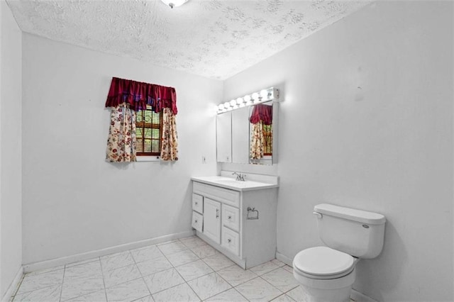 900 Fleetwood Cir, Atlanta, GA 30311 - bathroom with vanity, toilet, a textured ceiling, and baseboards