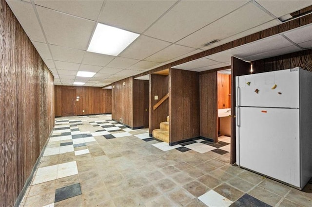 900 Fleetwood Cir, Atlanta, GA 30311 - finished basement featuring freestanding refrigerator, wood walls, stairs, and a paneled ceiling