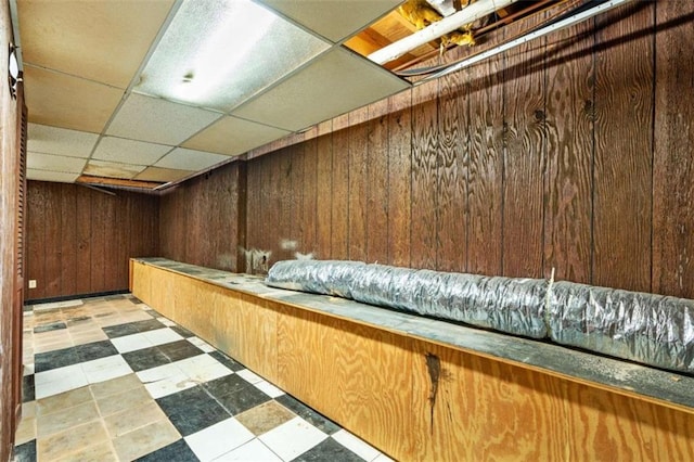 900 Fleetwood Cir, Atlanta, GA 30311 - finished basement featuring wood walls, a paneled ceiling, and tile patterned floors
