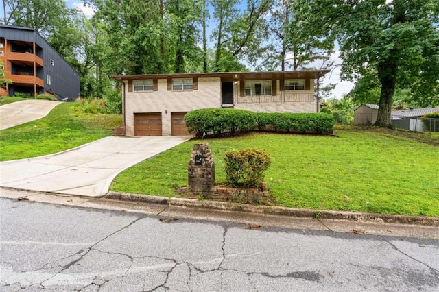 900 Fleetwood Cir, Atlanta, GA 30311 - view of front of home with driveway, a front lawn, and a garage