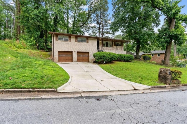 900 Fleetwood Cir, Atlanta, GA 30311 - view of front of property with concrete driveway, an attached garage, a front lawn, and brick siding