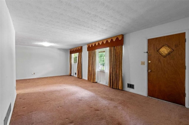 900 Fleetwood Cir, Atlanta, GA 30311 - foyer entrance featuring a textured ceiling and carpet floors