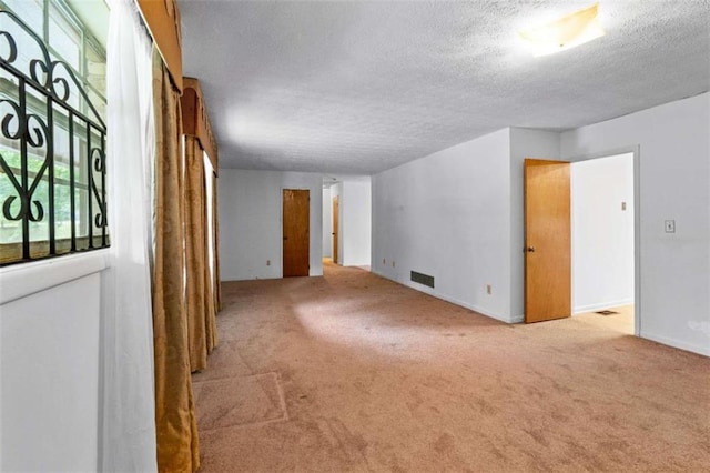 900 Fleetwood Cir, Atlanta, GA 30311 - empty room featuring a textured ceiling, carpet floors, and baseboards