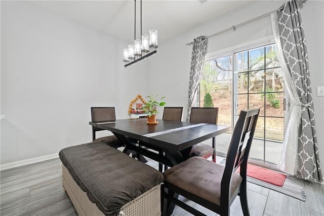545 Windstone Trl, Alpharetta, GA 30004 - dining room featuring light wood-style flooring, baseboards, and a chandelier
