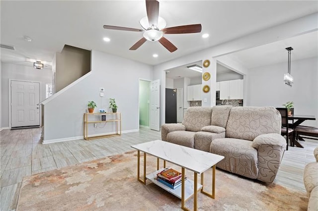 545 Windstone Trl, Alpharetta, GA 30004 - living room featuring light wood finished floors, ceiling fan, baseboards, and recessed lighting