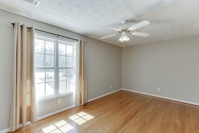 41 Pebble Ct, Hoschton, GA 30548 - unfurnished room featuring baseboards, a textured ceiling, a ceiling fan, and light wood finished floors