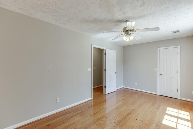41 Pebble Ct, Hoschton, GA 30548 - empty room with baseboards, a ceiling fan, visible vents, and light wood-type flooring