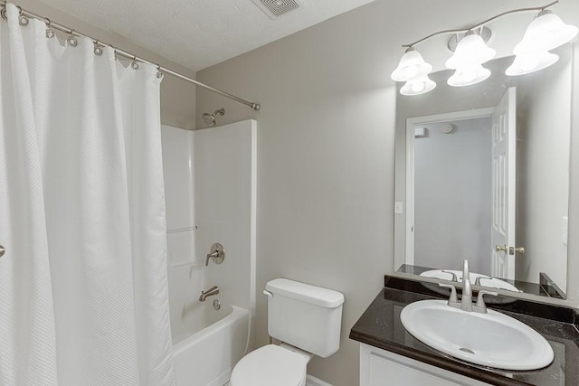 41 Pebble Ct, Hoschton, GA 30548 - bathroom with a textured ceiling, visible vents, toilet, vanity, and shower / tub combo with curtain