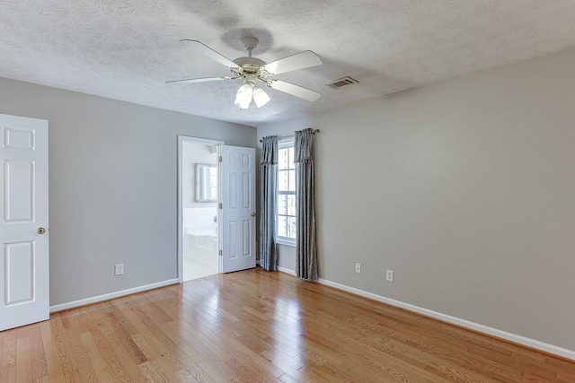 41 Pebble Ct, Hoschton, GA 30548 - empty room with baseboards, visible vents, and light wood finished floors