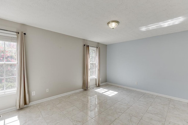 41 Pebble Ct, Hoschton, GA 30548 - empty room featuring baseboards and a textured ceiling