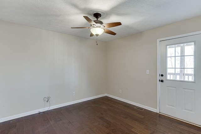 41 Pebble Ct, Hoschton, GA 30548 - interior space featuring baseboards, dark wood-style flooring, visible vents, and a ceiling fan