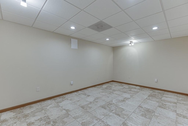 41 Pebble Ct, Hoschton, GA 30548 - finished below grade area with recessed lighting, baseboards, and a paneled ceiling
