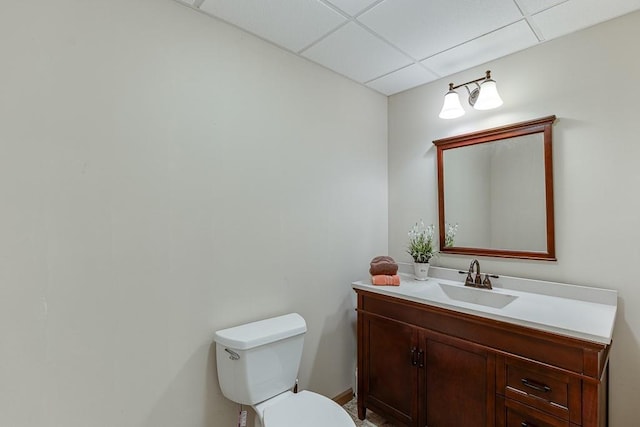 41 Pebble Ct, Hoschton, GA 30548 - half bath with a drop ceiling, toilet, and vanity