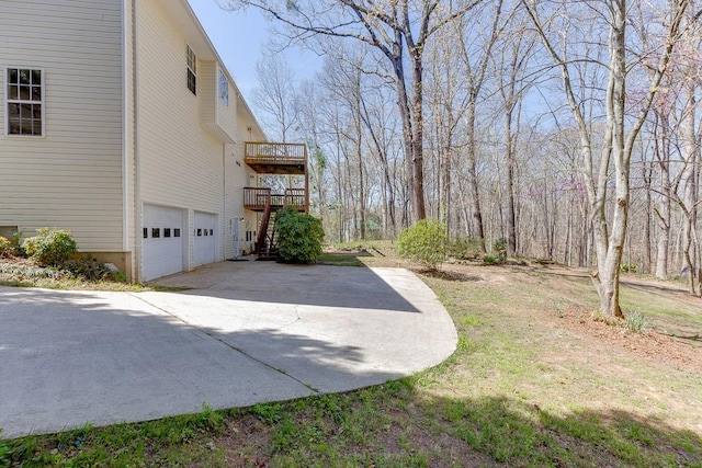41 Pebble Ct, Hoschton, GA 30548 - view of side of property with driveway and an attached garage