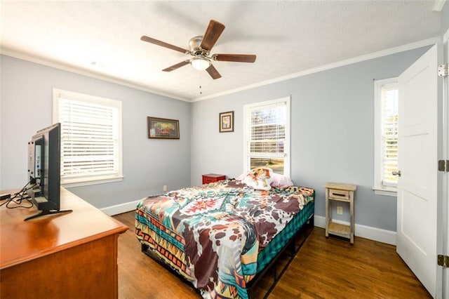 bedroom with ceiling fan, ornamental molding, and dark hardwood / wood-style flooring