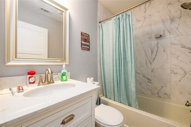 full bathroom with shower / bathtub combination with curtain, vanity, and toilet