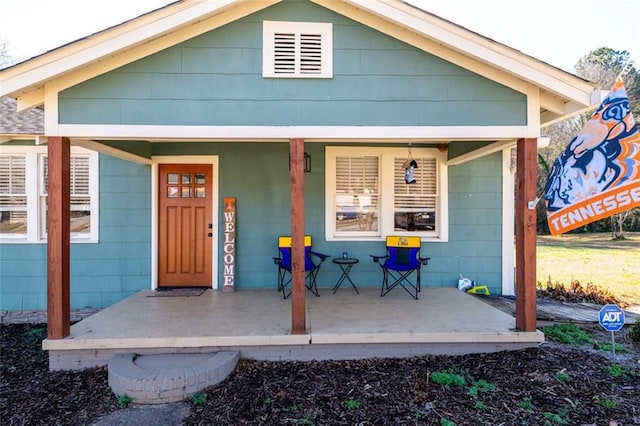 property entrance featuring covered porch