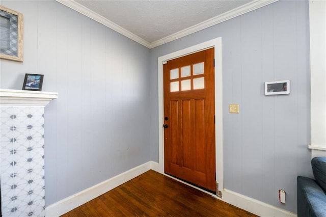 foyer entrance featuring dark hardwood / wood-style floors, ornamental molding, and wooden walls