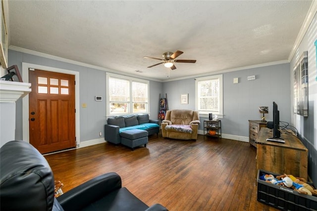 living room featuring ornamental molding, ceiling fan, dark wood-type flooring, and a textured ceiling