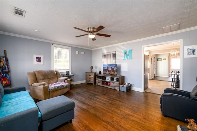 living room with a textured ceiling, ceiling fan with notable chandelier, dark hardwood / wood-style floors, and ornamental molding