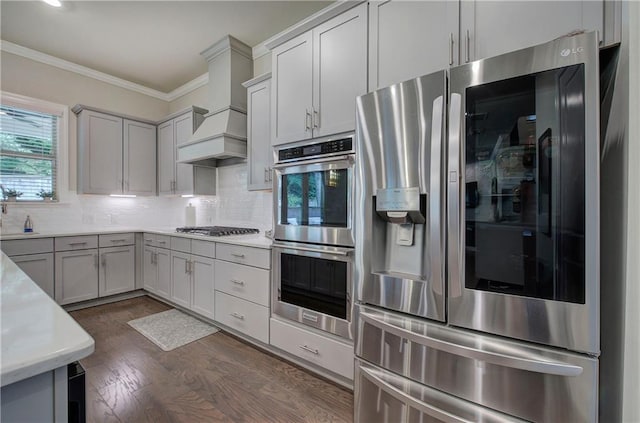 2657 Cedar Pine Way, Atlanta, GA 30360 - kitchen with appliances with stainless steel finishes, ornamental molding, light countertops, tasteful backsplash, and dark wood-style floors