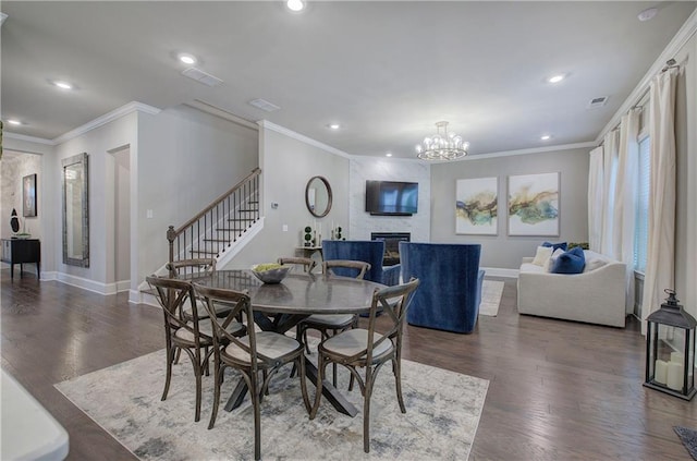 2657 Cedar Pine Way, Atlanta, GA 30360 - dining room with crown molding, stairs, a large fireplace, baseboards, and recessed lighting
