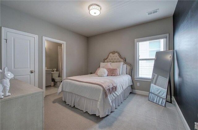2657 Cedar Pine Way, Atlanta, GA 30360 - bedroom featuring light carpet, baseboards, and ensuite bath