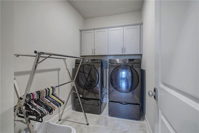 2657 Cedar Pine Way, Atlanta, GA 30360 - laundry room featuring washer and dryer, cabinet space, and baseboards