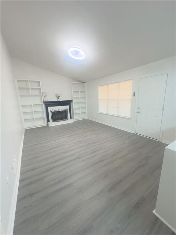 kitchen featuring sink, tasteful backsplash, appliances with stainless steel finishes, kitchen peninsula, and white cabinets