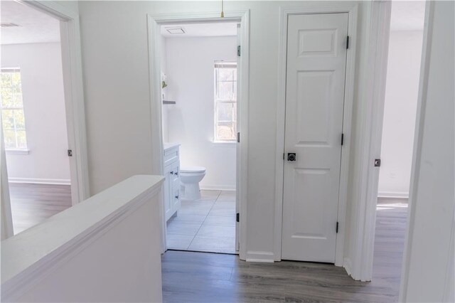 bathroom featuring hardwood / wood-style flooring and a shower with shower door