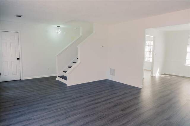 spare room featuring dark hardwood / wood-style floors