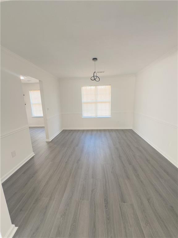 spare room featuring dark wood-type flooring