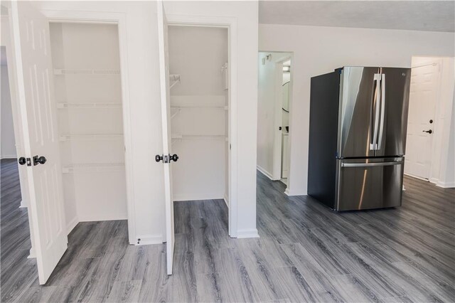 unfurnished dining area featuring dark hardwood / wood-style flooring