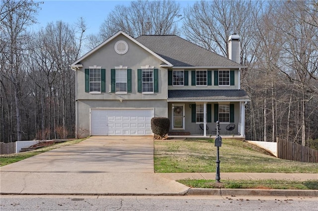 view of front facade featuring a garage and a front lawn