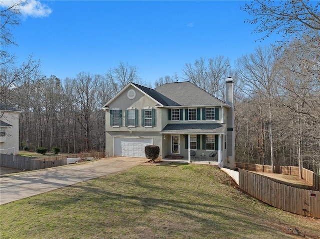 front of property featuring a porch, a garage, and a front yard