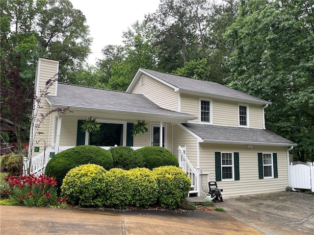 655 Chester Harris Dr, Dallas, GA 30132 - tri-level home featuring a chimney and view of scattered trees