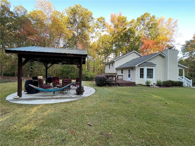 655 Chester Harris Dr, Dallas, GA 30132 - view of grassy yard featuring a gazebo, a wooden deck, and a patio area