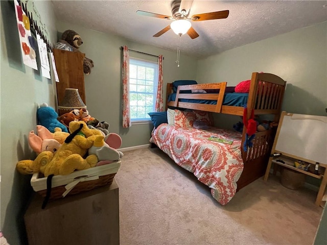 655 Chester Harris Dr, Dallas, GA 30132 - bedroom featuring a textured ceiling, carpet, a ceiling fan, and baseboards
