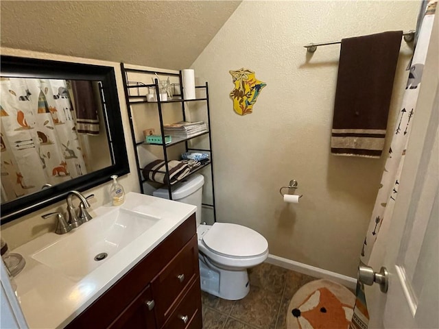 655 Chester Harris Dr, Dallas, GA 30132 - bathroom featuring toilet, vanity, a textured ceiling, tile patterned flooring, and baseboards
