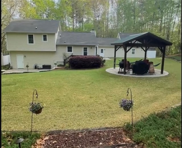655 Chester Harris Dr, Dallas, GA 30132 - rear view of house featuring a gazebo, a patio, and a yard