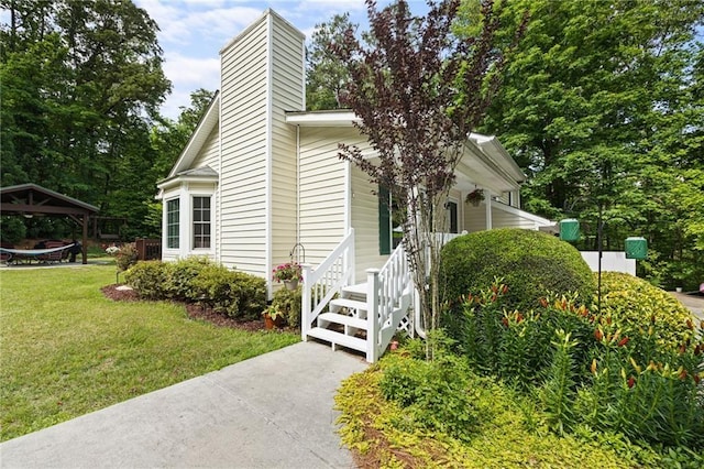 655 Chester Harris Dr, Dallas, GA 30132 - view of home's exterior with a gazebo, a lawn, and a chimney