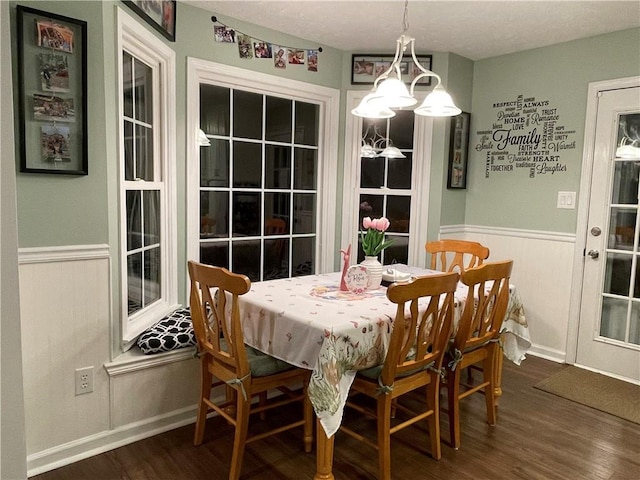 655 Chester Harris Dr, Dallas, GA 30132 - dining area with wainscoting and dark wood finished floors