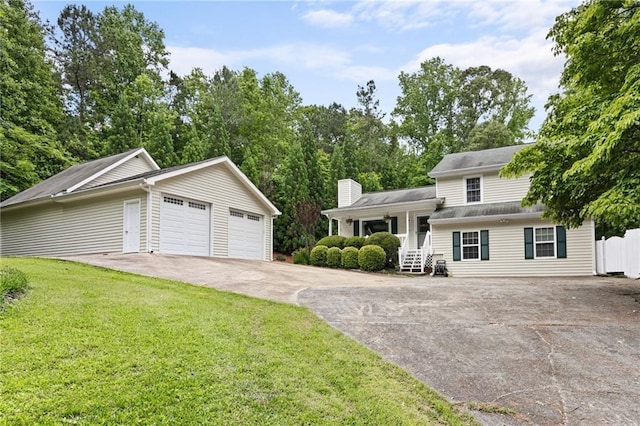 655 Chester Harris Dr, Dallas, GA 30132 - split level home featuring a front yard, covered porch, a chimney, and concrete driveway