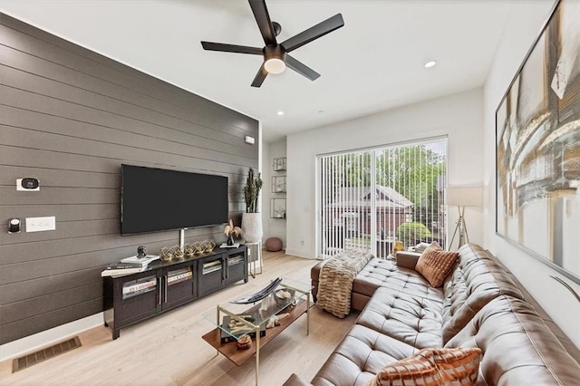 701 Pryor St SW Unit 5, Atlanta, GA 30315 - living area with ceiling fan, light wood finished floors, wood walls, recessed lighting, and baseboards