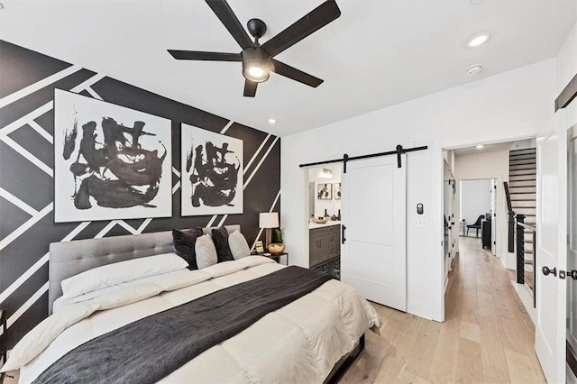701 Pryor St SW Unit 5, Atlanta, GA 30315 - bedroom featuring a barn door, hardwood / wood-style flooring, recessed lighting, ensuite bathroom, and ceiling fan