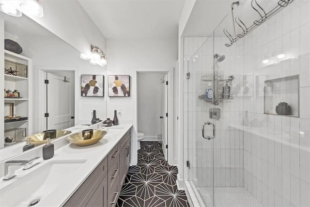 701 Pryor St SW Unit 5, Atlanta, GA 30315 - bathroom with toilet, a stall shower, double vanity, and tile patterned floors