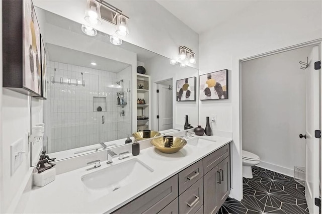 701 Pryor St SW Unit 5, Atlanta, GA 30315 - bathroom featuring a shower stall, toilet, double vanity, and tile patterned floors